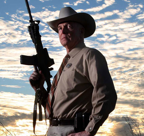 Texas Ranger holding semi-automatic rifle