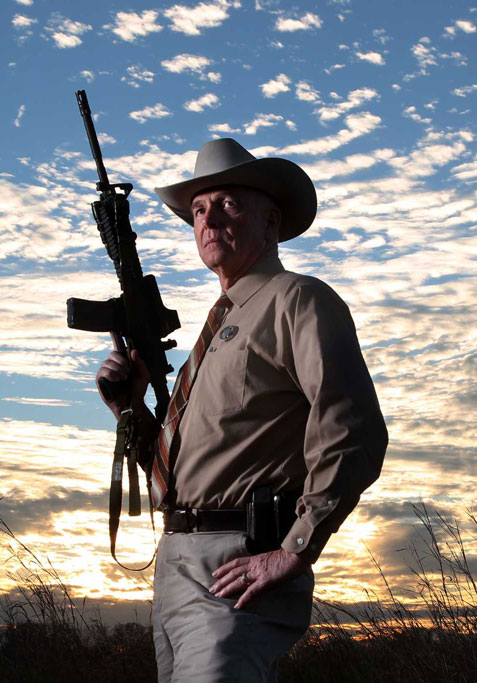 Texas Ranger holding semi-automatic rifle